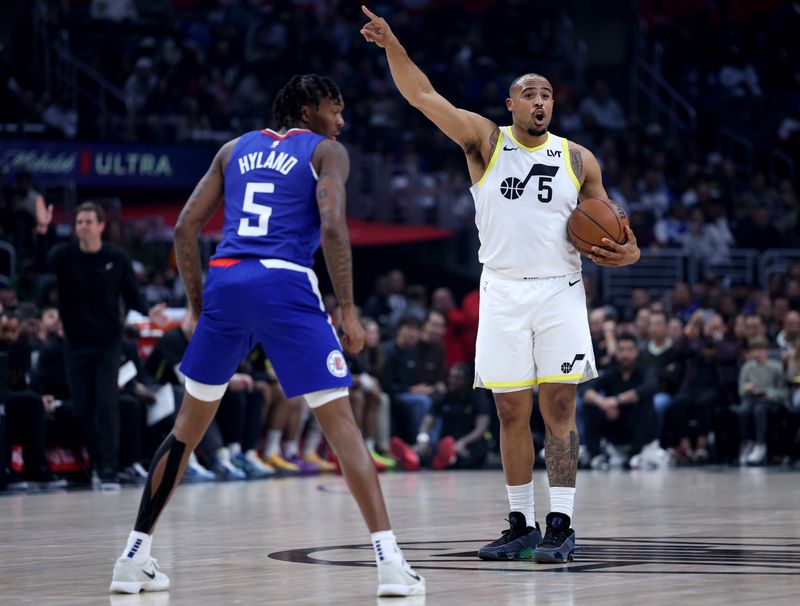 LOS ANGELES, CALIFORNIA - APRIL 12: Talen Horton-Tucker #5 of the Utah Jazz calls a play in front of Bones Hyland #5 of the LA Clippers at Crypto.com Arena on April 12, 2024 in Los Angeles, California. User is consenting to the terms and conditions of the Getty Images License Agreement.  (Photo by Harry How/Getty Images)