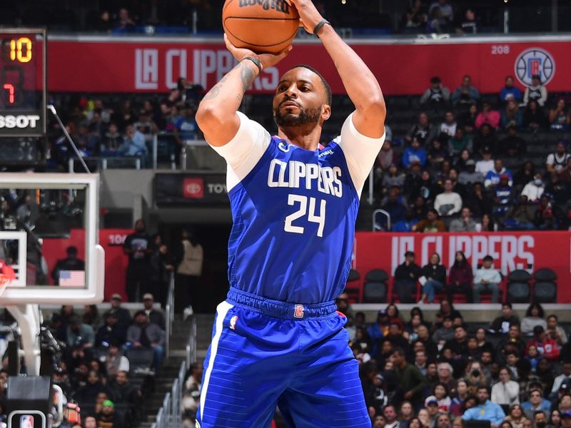 LOS ANGELES, CA - FEBRUARY 28: Norman Powell #24 of the LA Clippers shoots a three point basket during the game against the Minnesota Timberwolves on February 28, 2023 at Crypto.Com Arena in Los Angeles, California. NOTE TO USER: User expressly acknowledges and agrees that, by downloading and/or using this Photograph, user is consenting to the terms and conditions of the Getty Images License Agreement. Mandatory Copyright Notice: Copyright 2023 NBAE (Photo by Adam Pantozzi/NBAE via Getty Images)