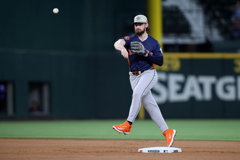 May 18, 2025; Arlington, Texas, USA; Houston Astros second base Brendan Rodgers (1) throws to first base during the second inning against the Texas Rangers at Globe Life Field. Mandatory Credit: Tim Heitman-Imagn Images