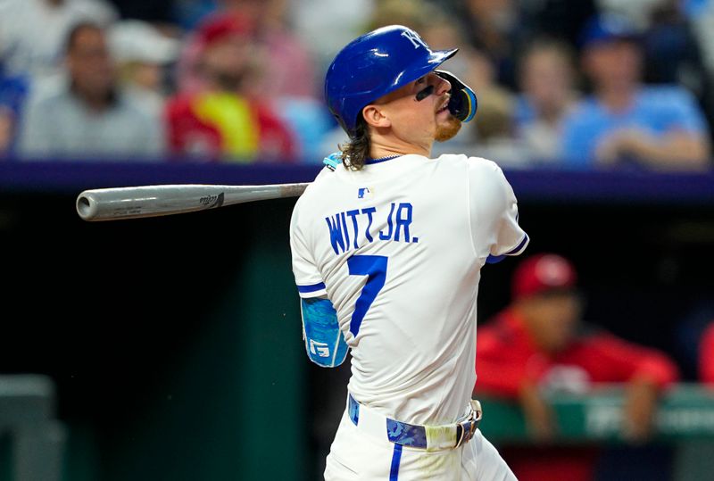 May 28, 2025; Kansas City, Missouri, USA; Kansas City Royals shortstop Bobby Witt Jr. (7) hits a sacrifice fly during the seventh inning against the Cincinnati Reds at Kauffman Stadium. Mandatory Credit: Jay Biggerstaff-Imagn Images