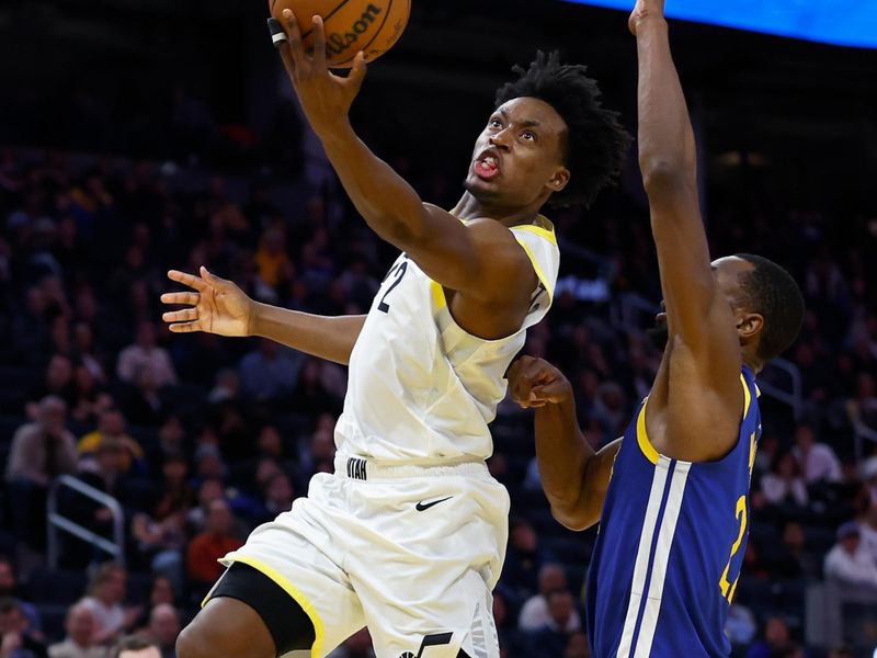 SAN FRANCISCO, CALIFORNIA - JANUARY 28: Collin Sexton #2 of the Utah Jazz goes to the basket against Andrew Wiggins #22 of the Golden State Warriors in the fourth quarter at Chase Center on January 28, 2025 in San Francisco, California. NOTE TO USER: User expressly acknowledges and agrees that, by downloading and or using this photograph, User is consenting to the terms and conditions of the Getty Images License Agreement. (Photo by Lachlan Cunningham/Getty Images)