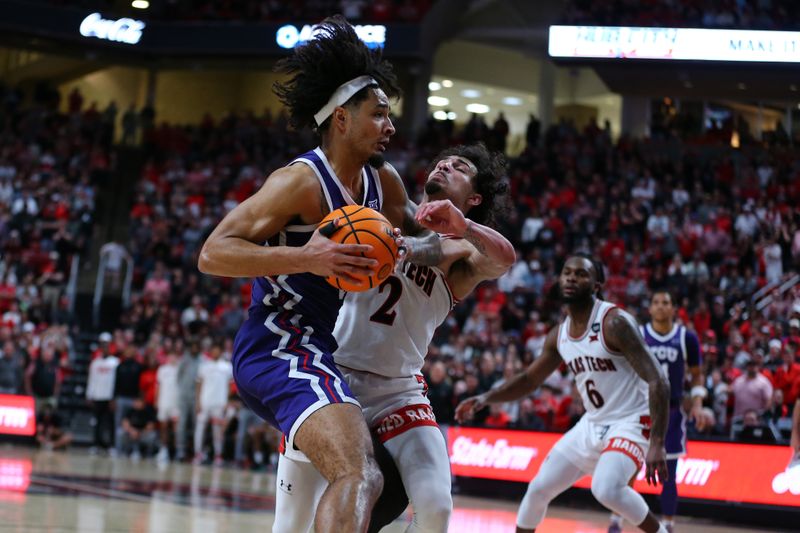 Feb 20, 2024; Lubbock, Texas, USA;  Texas Tech Red Raiders guard Pop Isaacs (2) fouls TCU Horned Frogs guard Micah Peavy (0) in the second half at United Supermarkets Arena. Mandatory Credit: Michael C. Johnson-USA TODAY Sports