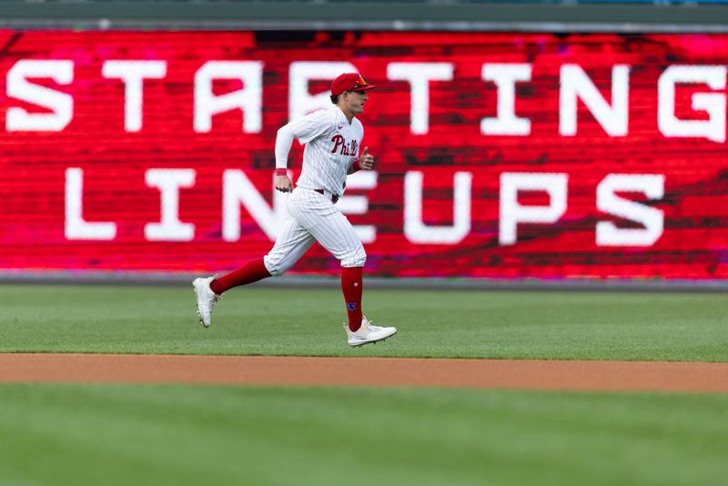 Jul 27, 2024; Philadelphia, Pennsylvania, USA;  Philadelphia Phillies outfielder Austin Hayes (9) warms up before action against the Cleveland Guardians at Citizens Bank Park. Mandatory Credit: Bill Streicher-USA TODAY Sports