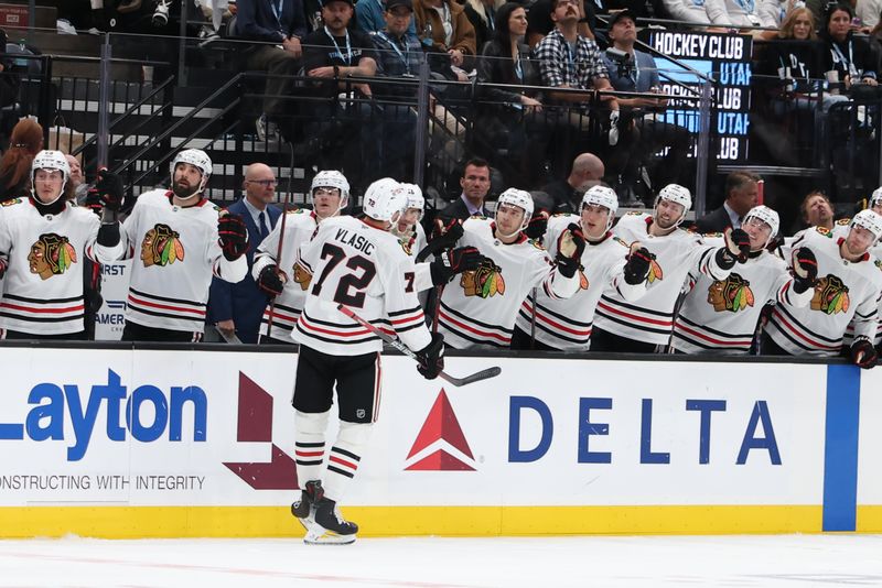 Oct 8, 2024; Salt Lake City, Utah, USA; Chicago Blackhawks defenseman Alex Vlasic (72) celebrates a goal against the Utah Hockey Club with teammates during the third period at Delta Center. Mandatory Credit: Rob Gray-Imagn Images