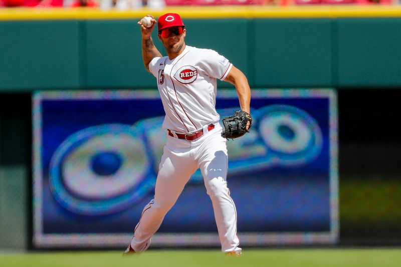 Aug 6, 2023; Cincinnati, Ohio, USA; Cincinnati Reds third baseman Nick Senzel (15) throws to first to get Washington Nationals third baseman Ildemaro Vargas (not pictured) out in the fifth inning at Great American Ball Park. Mandatory Credit: Katie Stratman-USA TODAY Sports