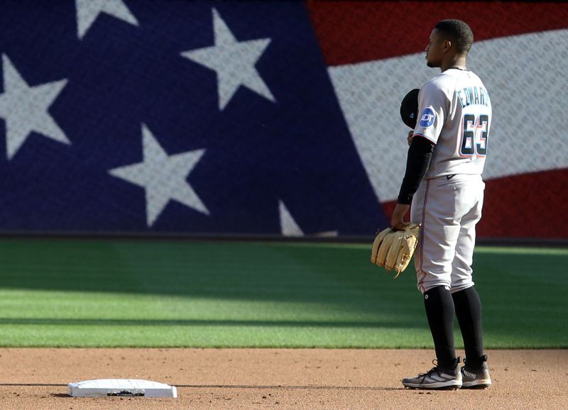 Oct 1, 2023; Pittsburgh, Pennsylvania, USA;  Miami Marlins second baseman Xavier Edwards (63) stands for the playing of God Bless America  against the Pittsburgh Pirates during the seventh inning at PNC Park. Mandatory Credit: Charles LeClaire-USA TODAY Sports