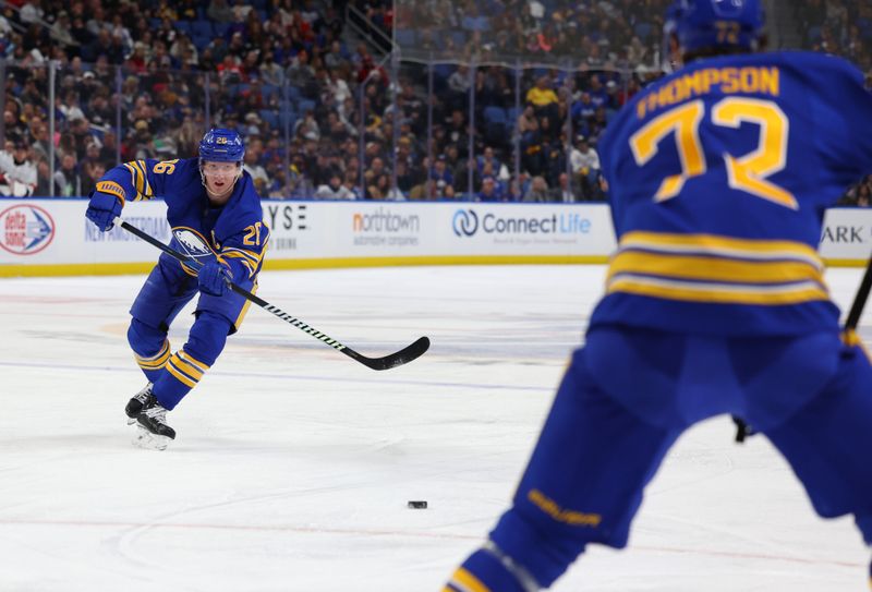 Oct 12, 2024; Buffalo, New York, USA;  Buffalo Sabres defenseman Rasmus Dahlin (26) makes a pass to center Tage Thompson (72) during the second period against the Florida Panthers at KeyBank Center. Mandatory Credit: Timothy T. Ludwig-Imagn Images