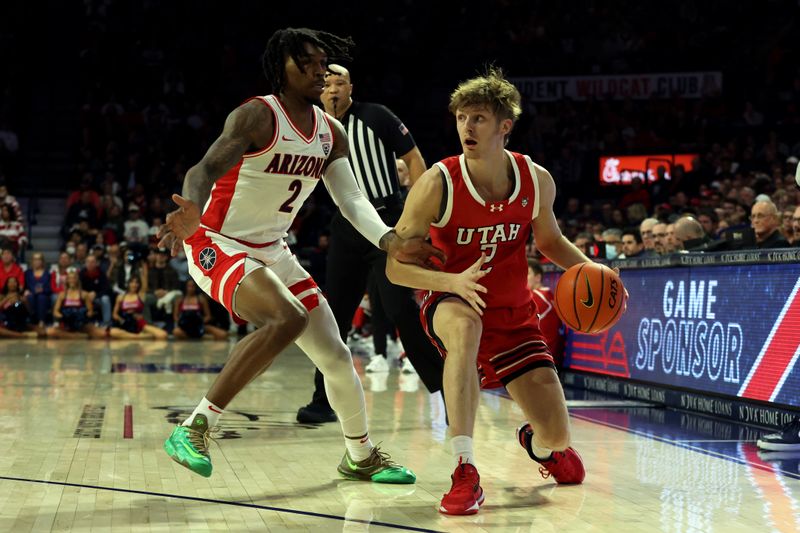 Jan 6, 2024; Tucson, Arizona, USA; Utah Utes guard Cole Bajema (2) dribbles the ball against Arizona Wildcats guard Caleb Love (2) during the first half at McKale Center. Mandatory Credit: Zachary BonDurant-USA TODAY Sports