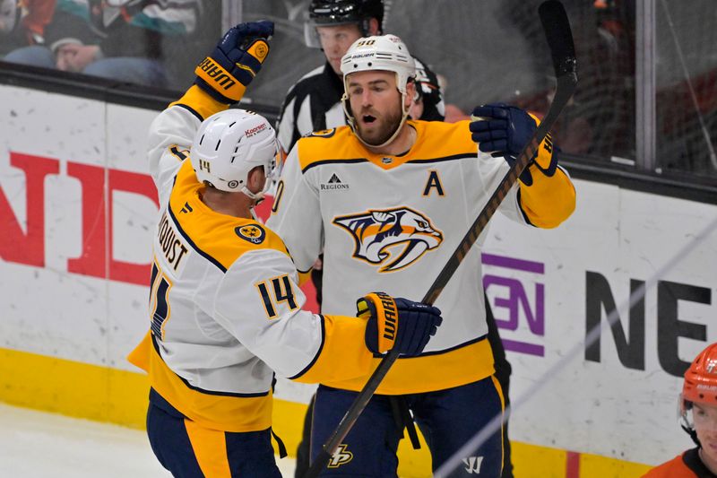 Jan 25, 2025; Anaheim, California, USA; Nashville Predators center Ryan O'Reilly (90) is congratulated by center Gustav Nyquist (14) after scoring a goal in the second period against the Anaheim Ducks at Honda Center. Mandatory Credit: Jayne Kamin-Oncea-Imagn Images