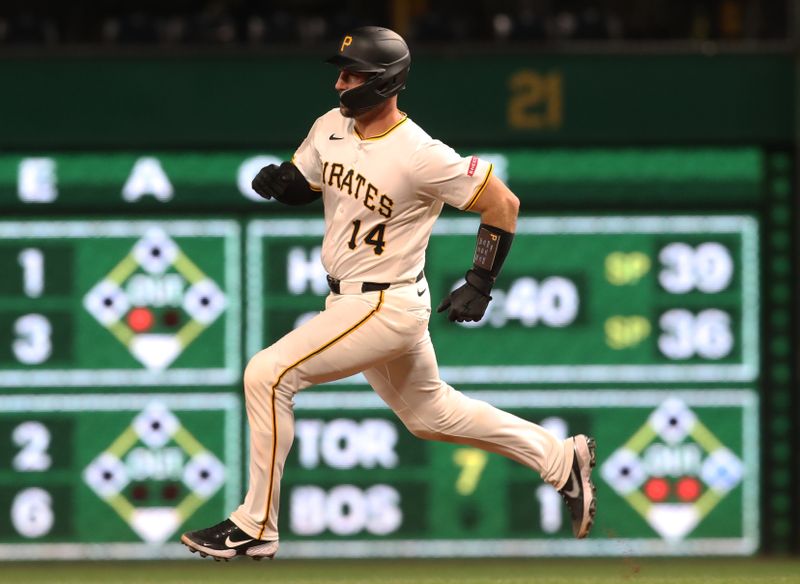Apr 7, 2025; Pittsburgh, Pennsylvania, USA;  Pittsburgh Pirates catcher Joey Bart (14) runs the bases on an RBI triple against the St. Louis Cardinals during the seventh inning at PNC Park. Mandatory Credit: Charles LeClaire-Imagn Images