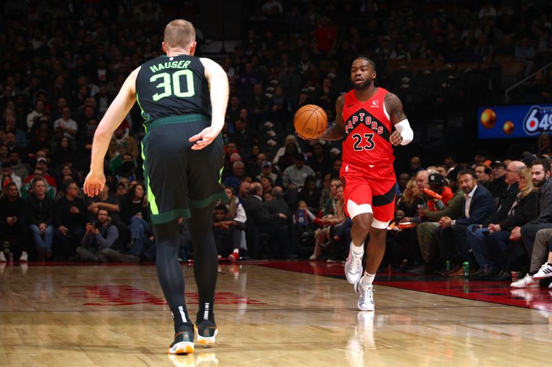 TORONTO, CANADA - JANUARY 15: Jamal Shead #23 of the Toronto Raptors dribbles the ball during the game against the Boston Celtics on January 15, 2025 at the Scotiabank Arena in Toronto, Ontario, Canada.  NOTE TO USER: User expressly acknowledges and agrees that, by downloading and or using this Photograph, user is consenting to the terms and conditions of the Getty Images License Agreement.  Mandatory Copyright Notice: Copyright 2025 NBAE (Photo by Vaughn Ridley/NBAE via Getty Images)