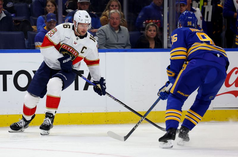 Oct 28, 2024; Buffalo, New York, USA;  Florida Panthers center Aleksander Barkov (16) looks to make a pass as Buffalo Sabres right wing Nicolas Aube-Kubel (96) defends during the first period at KeyBank Center. Mandatory Credit: Timothy T. Ludwig-Imagn Images