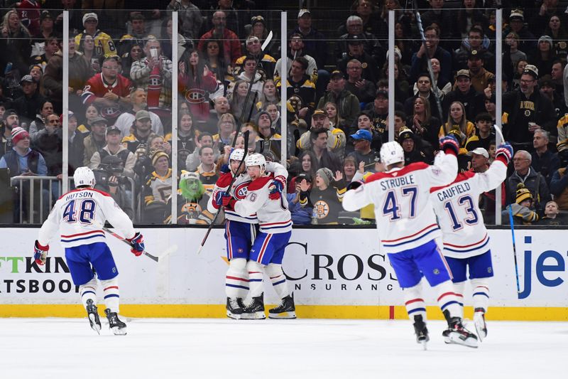 Dec 23, 2025; Boston, Massachusetts, USA;  Montreal Canadians center Nick Suzuki (14) reacts after scoring a goal during the third period against the Boston Bruins at TD Garden. Mandatory Credit: Bob DeChiara-Imagn Images