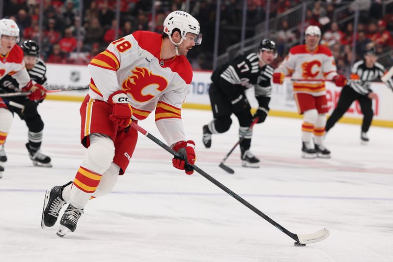 Mar 12, 2026; Newark, New Jersey, USA; Calgary Flames center John Beecher (18) skates with the puck against the New Jersey Devils during the first period at Prudential Center. Mandatory Credit: Ed Mulholland-Imagn Images