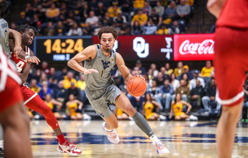 Feb 4, 2023; Morgantown, West Virginia, USA; West Virginia Mountaineers forward Emmitt Matthews Jr. (1) dribbles during the second half against the Oklahoma Sooners at WVU Coliseum. Mandatory Credit: Ben Queen-USA TODAY Sports