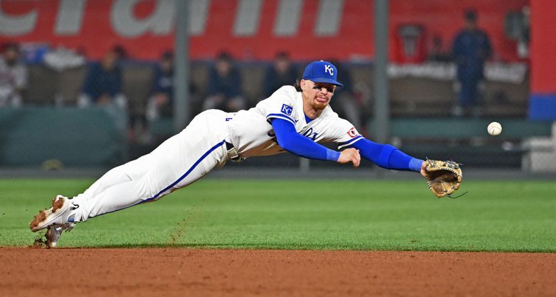 Aug 5, 2024; Kansas City, Missouri, USA;  Kansas City Royals shortstop Bobby Witt Jr. (7) dives for a ground ball hit by Boston Red Sox Ceddanne Rafaela (not pictured) in the seventh inning at Kauffman Stadium. Mandatory Credit: Peter Aiken-USA TODAY Sports