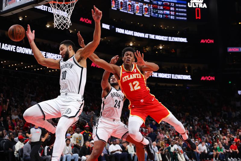 ATLANTA, GEORGIA - OCTOBER 23: Cam Thomas #24 of the Brooklyn Nets fouls De'Andre Hunter #12 of the Atlanta Hawks during the fourth quarter at State Farm Arena on October 23, 2024 in Atlanta, Georgia. NOTE TO USER: User expressly acknowledges and agrees that, by downloading and or using this photograph, User is consenting to the terms and conditions of the Getty Images License Agreement. (Photo by Kevin C. Cox/Getty Images)