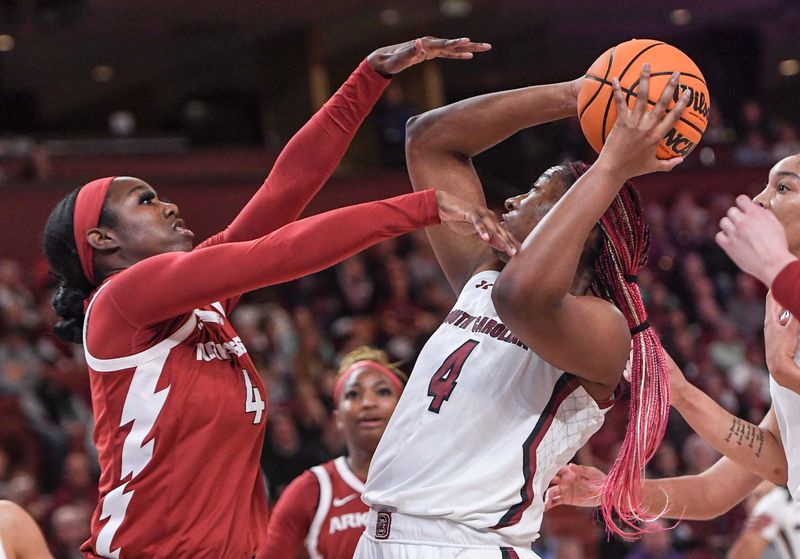 Mar 3, 2023; Greenville, SC, USA; South Carolina forward Aliyah Boston (4) shoots near Arkansas forward Erin Barnum (4) during the first quarter at Bon Secours Wellness Arena. Mandatory Credit: Ken Ruinard-USA TODAY Sports