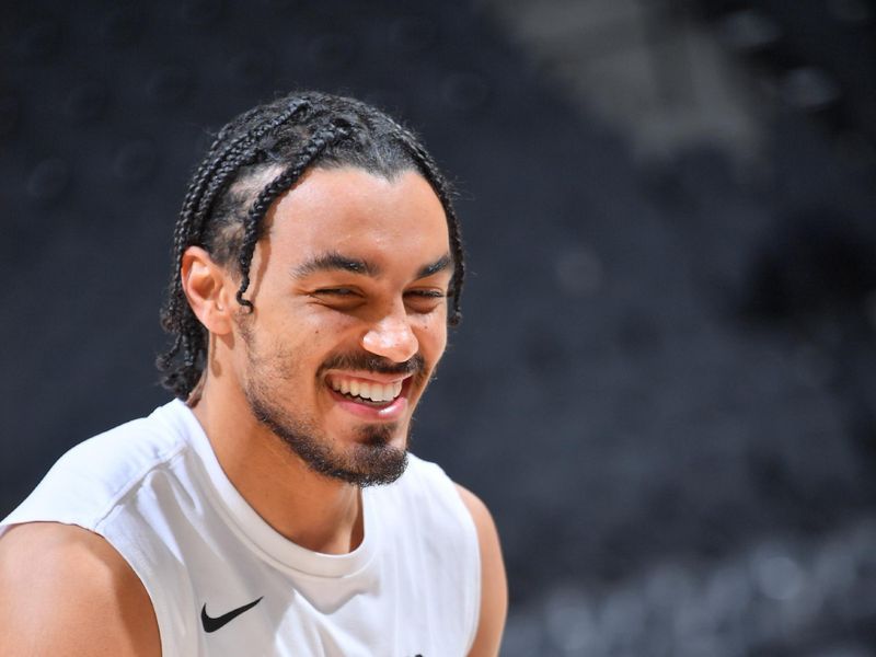 SAN ANTONIO, TX - APRIL 12:  Tre Jones #33 of the San Antonio Spurs looks on before the game on April 12, 2024 at the AT&T Center in San Antonio, Texas. NOTE TO USER: User expressly acknowledges and agrees that, by downloading and or using this photograph, user is consenting to the terms and conditions of the Getty Images License Agreement. Mandatory Copyright Notice: Copyright 2024 NBAE (Photos by Michael Gonzales/NBAE via Getty Images)