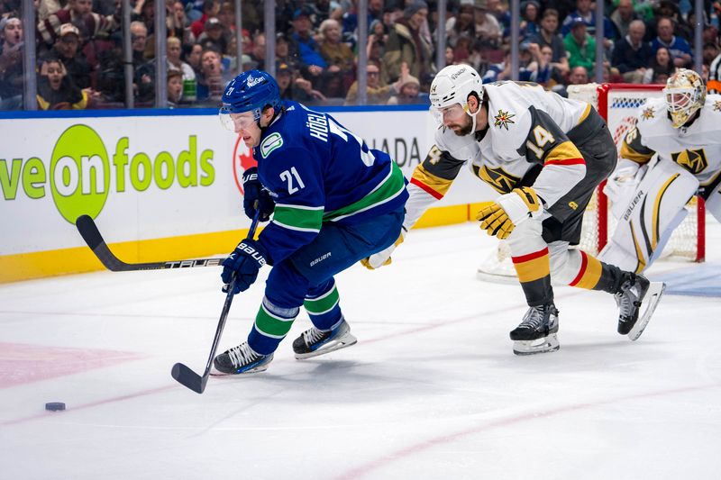 Apr 8, 2024; Vancouver, British Columbia, CAN; Vegas Golden Knights defenseman Nicolas Hague (14) stick checks Vancouver Canucks forward Nils Hoglander (21) in the third period at Rogers Arena. Canucks won 4 -3. Mandatory Credit: Bob Frid-USA TODAY Sports