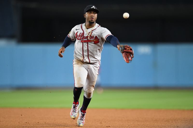 Sep 2, 2023; Los Angeles, California, USA; Atlanta Braves second baseman Ozzie Albies (1) fields a ball against the Los Angeles Dodgers during the sixth inning at Dodger Stadium. Mandatory Credit: Jonathan Hui-USA TODAY Sports