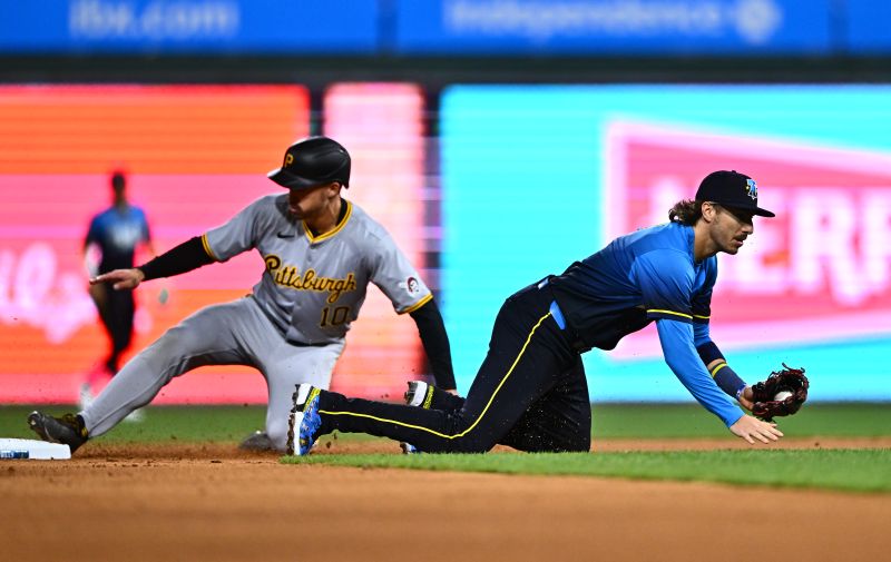 Apr 12, 2024; Philadelphia, Pennsylvania, USA; Philadelphia Phillies second baseman Bryson Stott (5) traps a throw as Pittsburgh Pirates outfielder Bryan Reynolds (10) steals second in the seventh inning at Citizens Bank Park. Mandatory Credit: Kyle Ross-USA TODAY Sports
