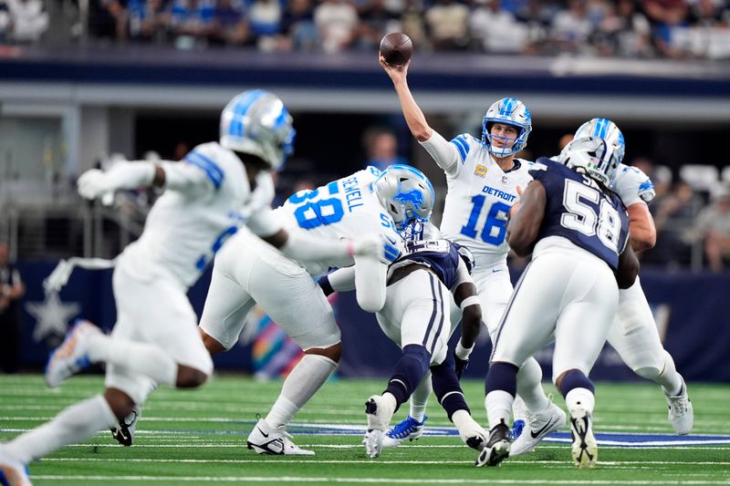 Detroit Lions quarterback Jared Goff (16) throws a pass as Dallas Cowboys defensive tackle Mazi Smith (58) pressures in the first half of an NFL football game in Arlington, Texas, Sunday, Oct. 13, 2024. (AP Photo/LM Otero)