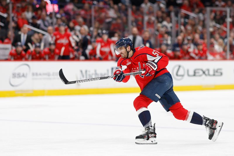 Apr 7, 2024; Washington, District of Columbia, USA; Washington Capitals defenseman Trevor van Riemsdyk (57) shoots the puck against the Ottawa Senators in the third period at Capital One Arena. Mandatory Credit: Geoff Burke-USA TODAY Sports