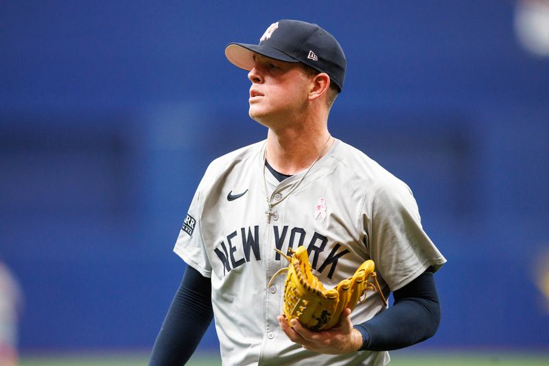 May 12, 2024; St. Petersburg, Florida, USA;  New York Yankees pitcher Caleb Ferguson (64) leaves the game against the Tampa Bay Rays in the seventh inning at Tropicana Field. Mandatory Credit: Nathan Ray Seebeck-USA TODAY Sports