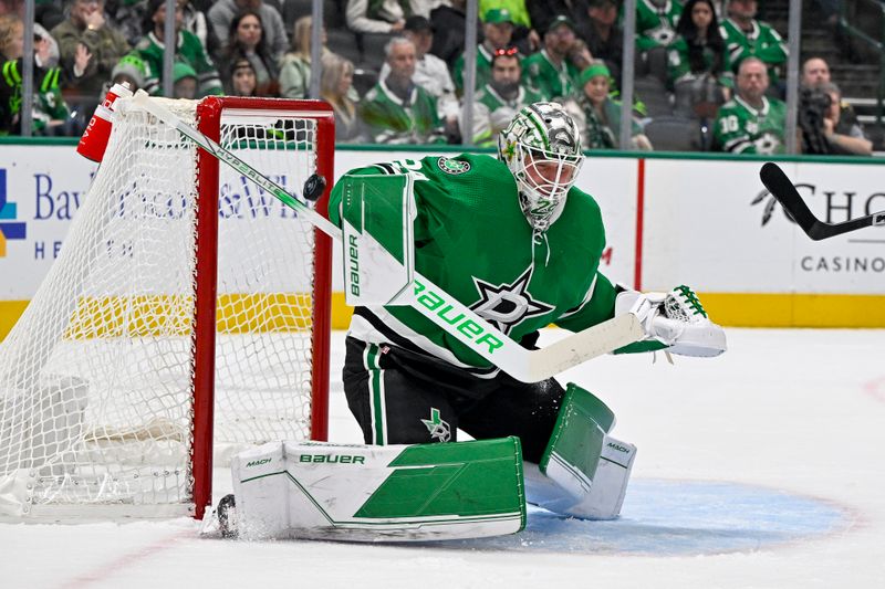 Dec 9, 2023; Dallas, Texas, USA; Dallas Stars goaltender Jake Oettinger (29) makes a stick save on a shot by the Vegas Golden Knights during the first period at the American Airlines Center. Mandatory Credit: Jerome Miron-USA TODAY Sports