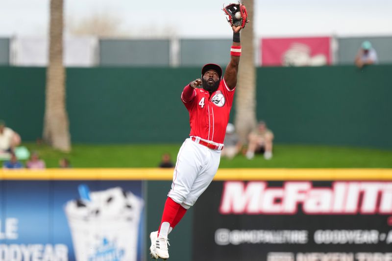 Feb 26, 2024; Goodyear, AZ, USA; Cincinnati Reds second baseman Josh Harrison leaps to catch a line drive for an out in the first inning during a MLB spring training baseball game against the Seattle Mariners, Monday, Feb. 26, 2024, at Goodyear Ballpark in Goodyear, Ariz. Mandatory Credit: Kareem Elgazzar-USA TODAY Sports